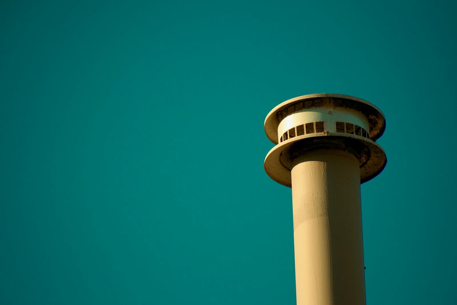 Air traffic control tower rising against the sky
